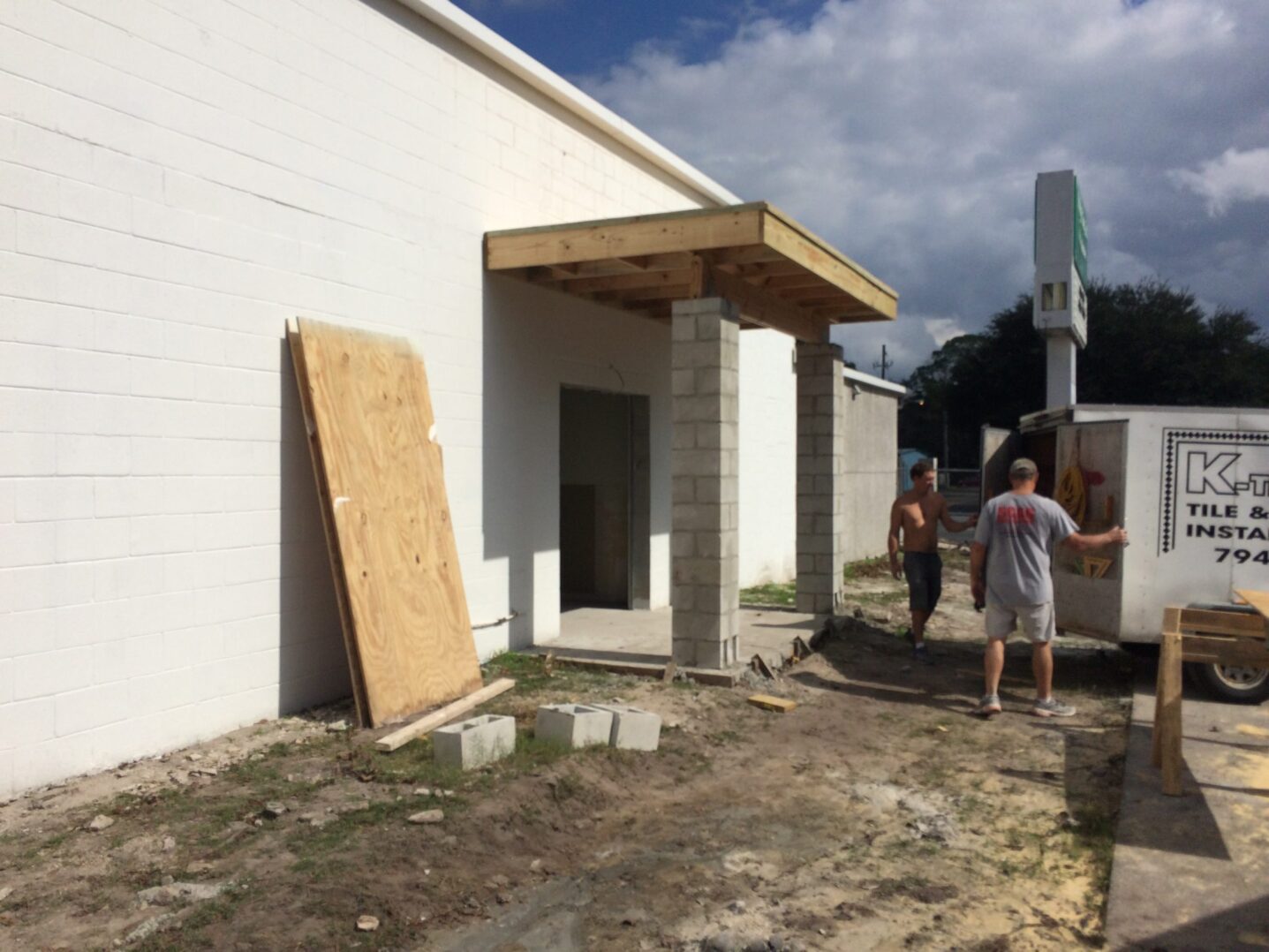 A green megaphone is on the black background