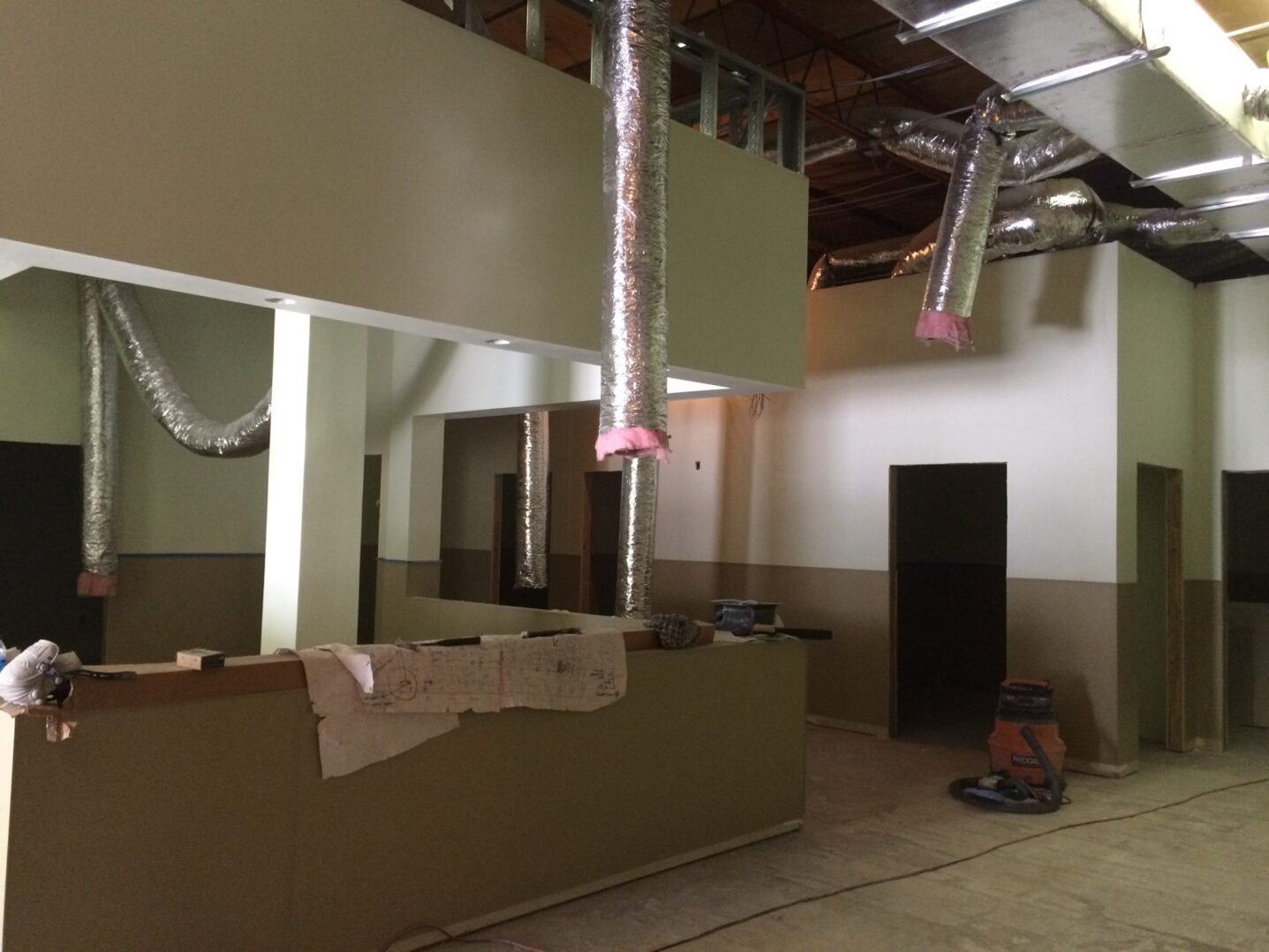 A green megaphone is on the black background