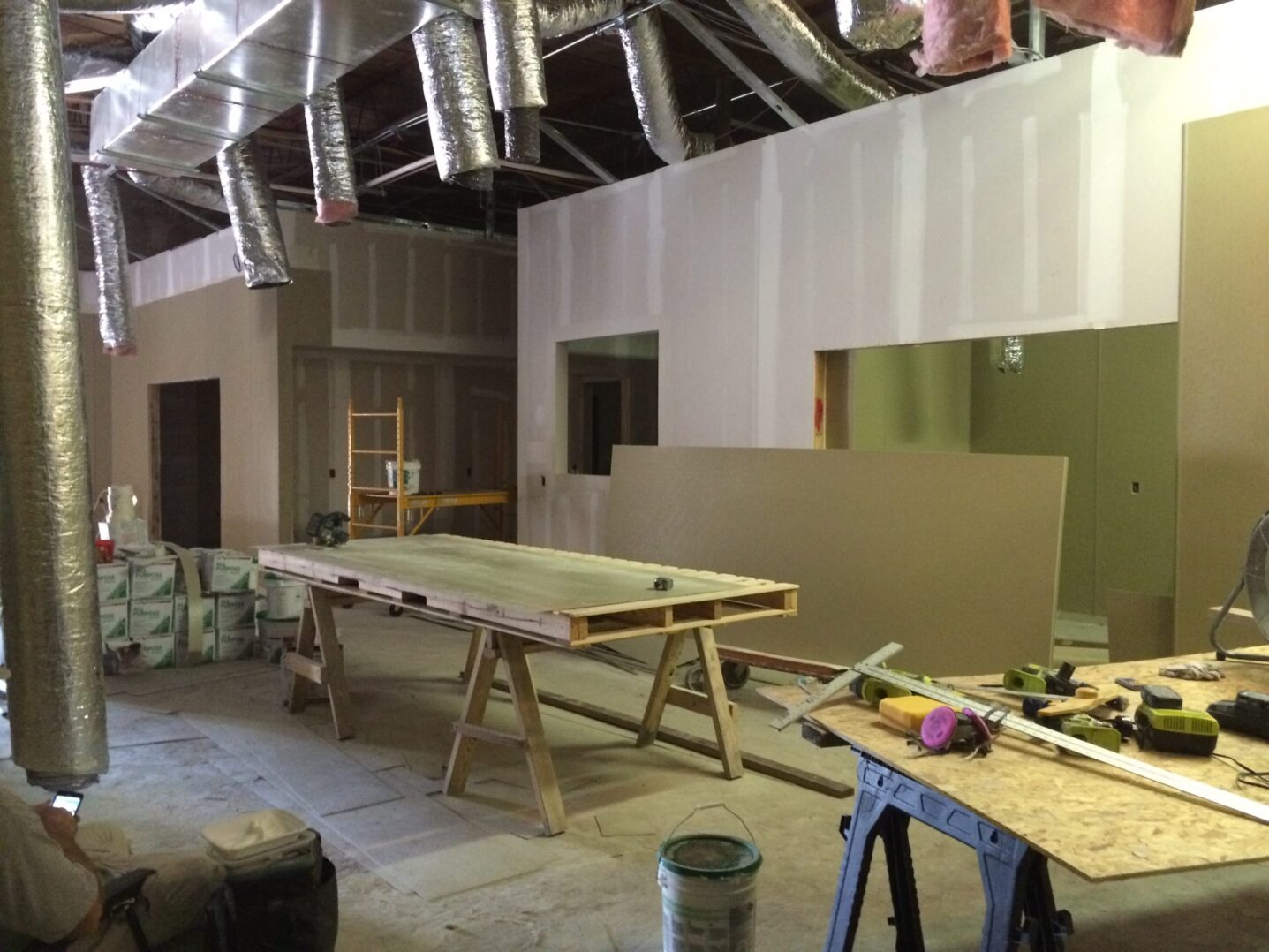 A green megaphone is on the black background