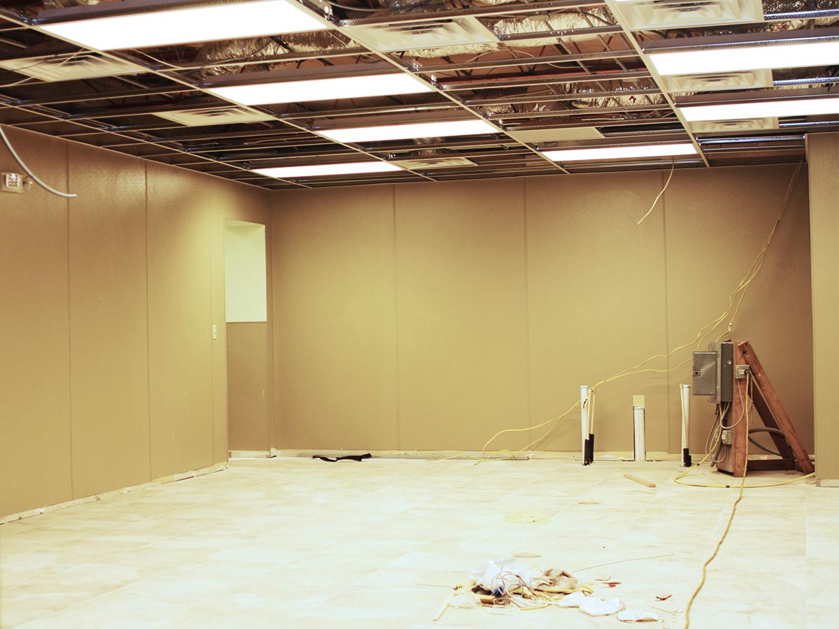 A room with no walls and some electrical wires.