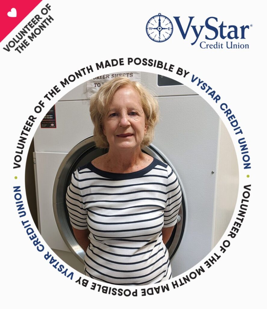 A green megaphone is on the black background