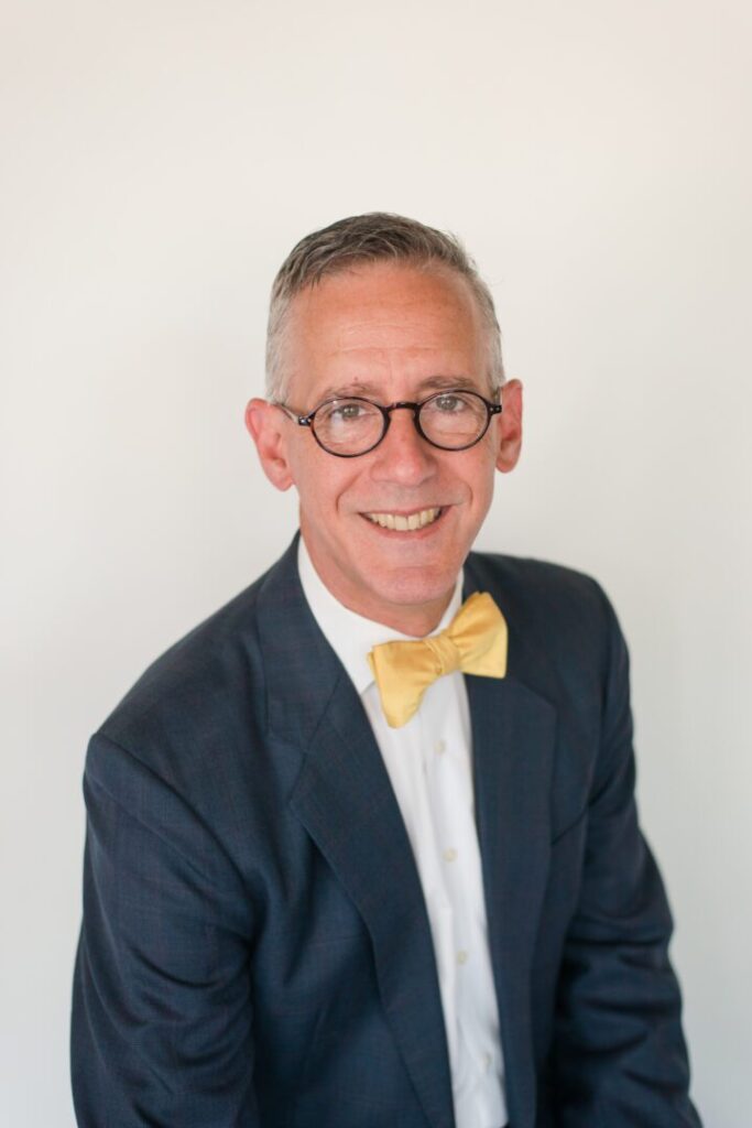 A green megaphone is on the black background