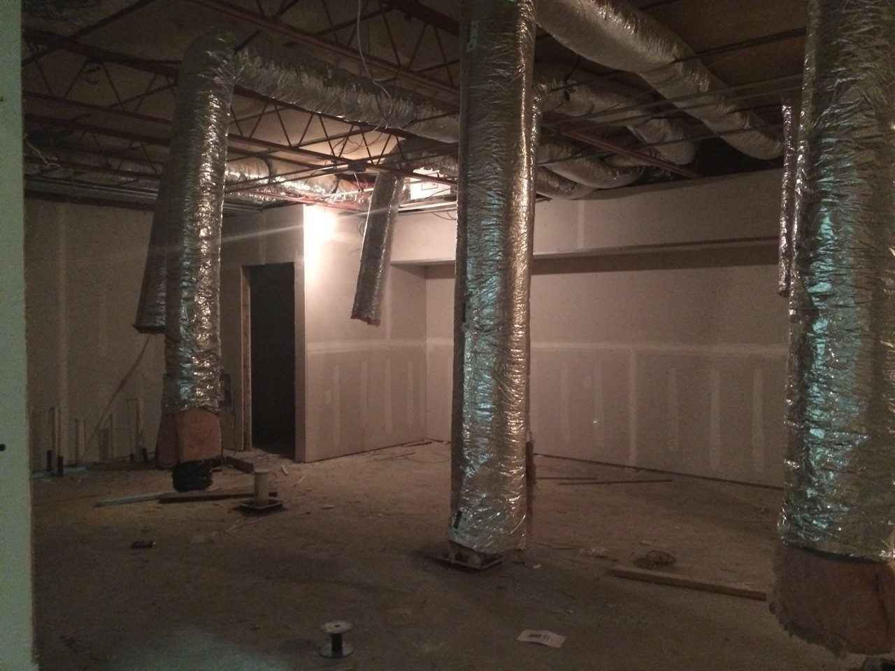 A green megaphone is on the black background