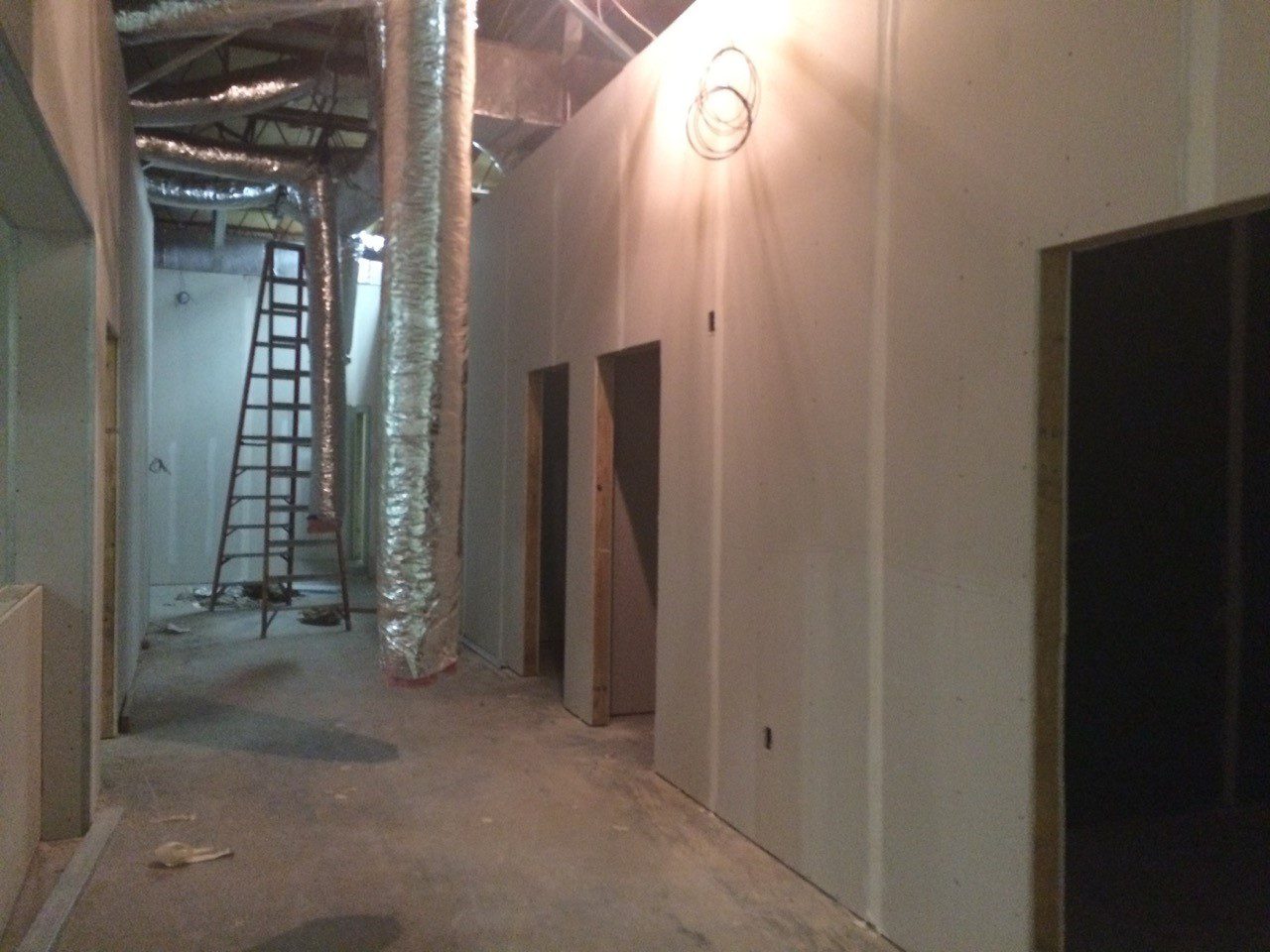 A green megaphone is on the black background