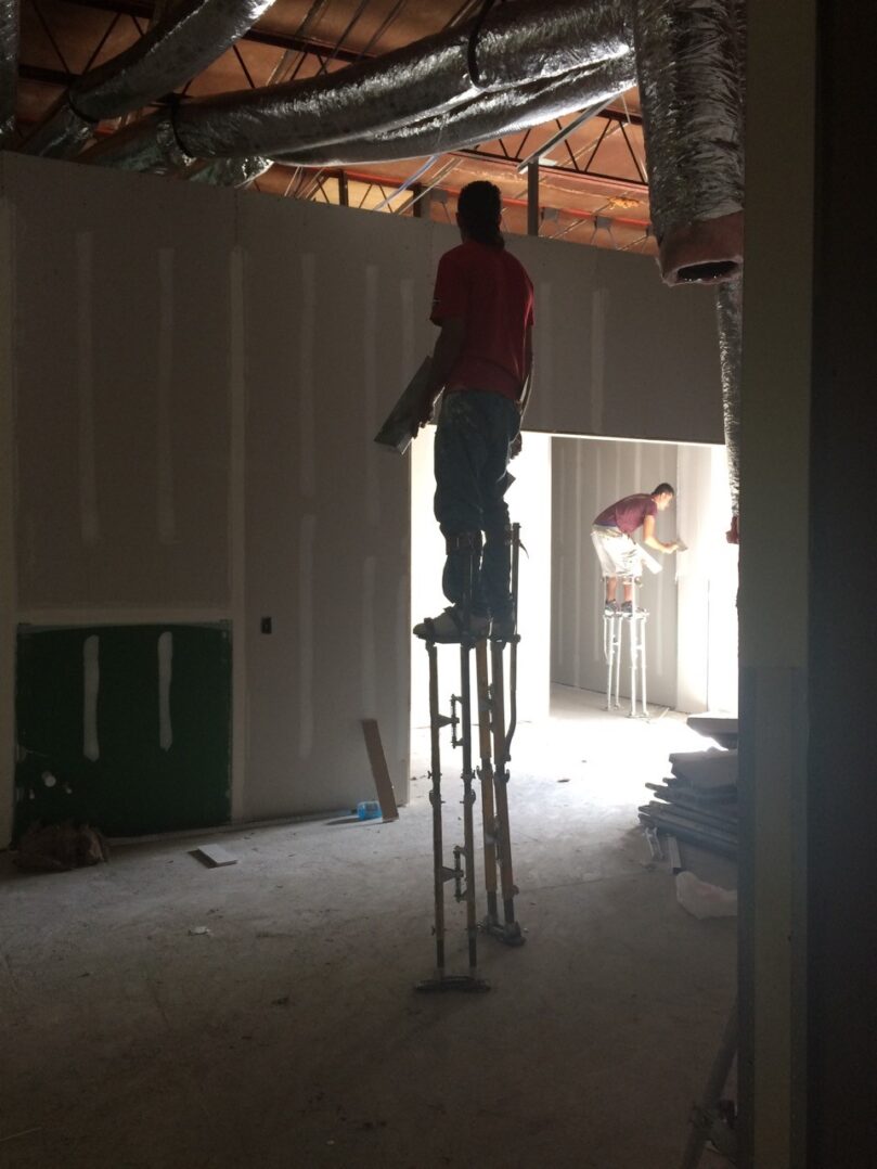 A green megaphone is on the black background