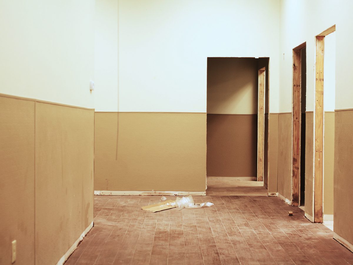 A room with two walls and a door.